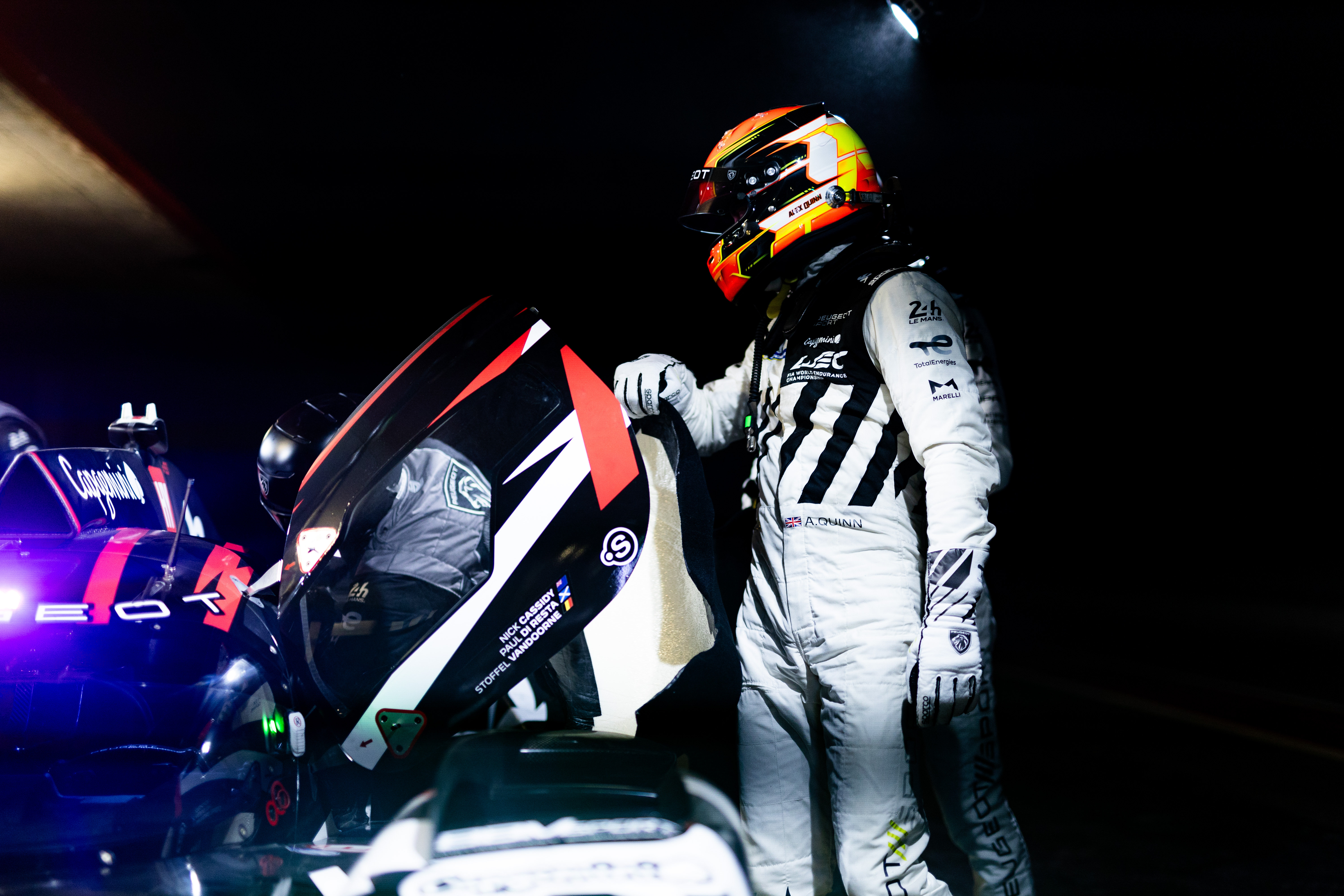 Alex Quinn next to his Peugeuot Hypercar