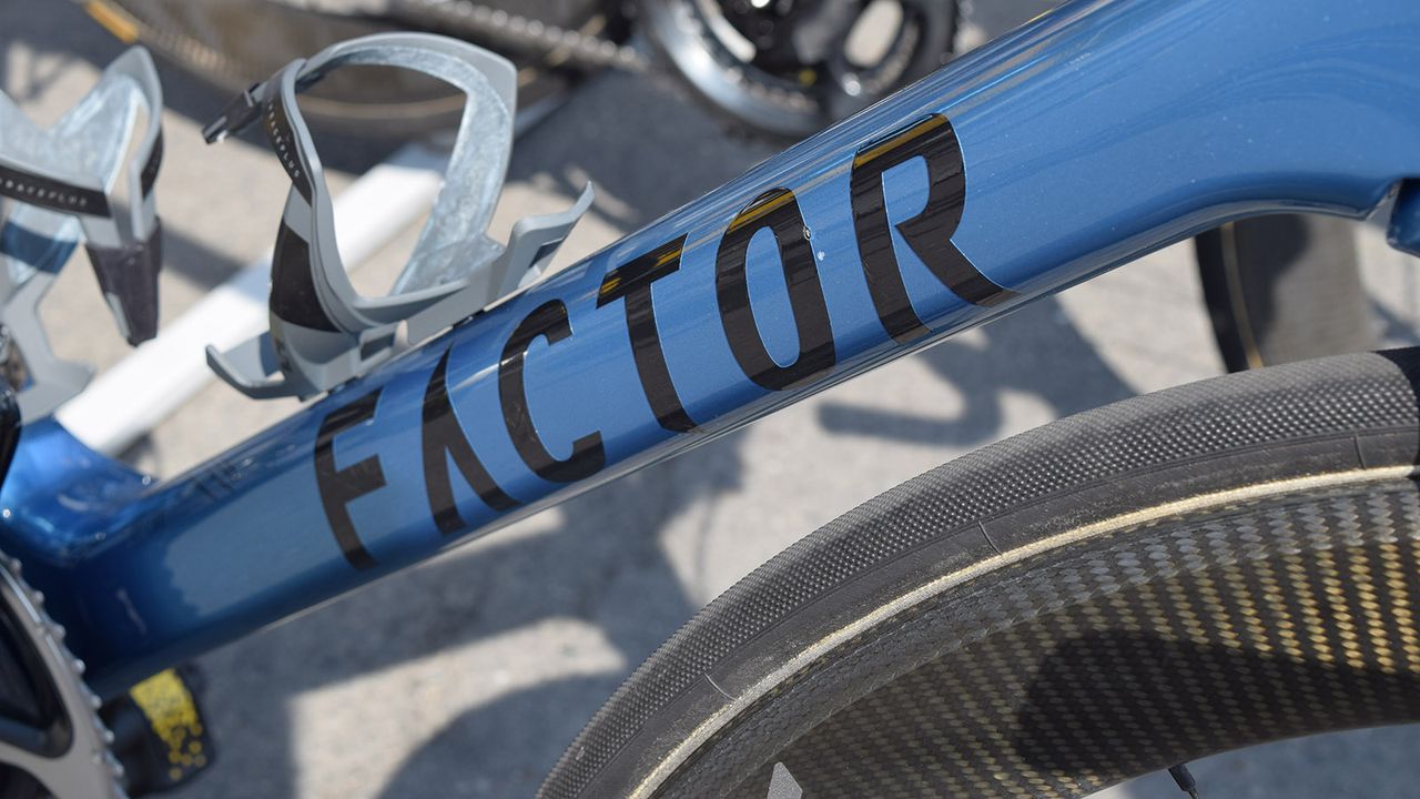 Black decals contrast against the blue metallic finish