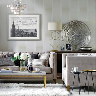 living room with lustrous wallpaper and cityscape print