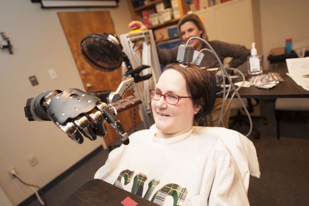 quadriplegic uses mind-controlled prosthetic