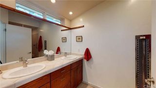 A dated bathroom with a double vanity
