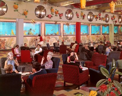 Butlin&#039;s 1960s-70s John Hinde photograph of people in lounge with swimming pool wall