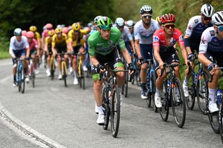 COLLU FANCUAYA SPAIN AUGUST 27 LR Sam Bennett of Ireland and Team Bora Hansgrohe Green Points Jersey and Remco Evenepoel of Belgium and Team QuickStep Alpha Vinyl Red Leader Jersey compete during the 77th Tour of Spain 2022 Stage 8 a 1534km stage from Pola de Laviana to Collu Fancuaya 1084m LaVuelta22 WorldTour on August 27 2022 in Collu Fancuaya Spain Photo by Justin SetterfieldGetty Images