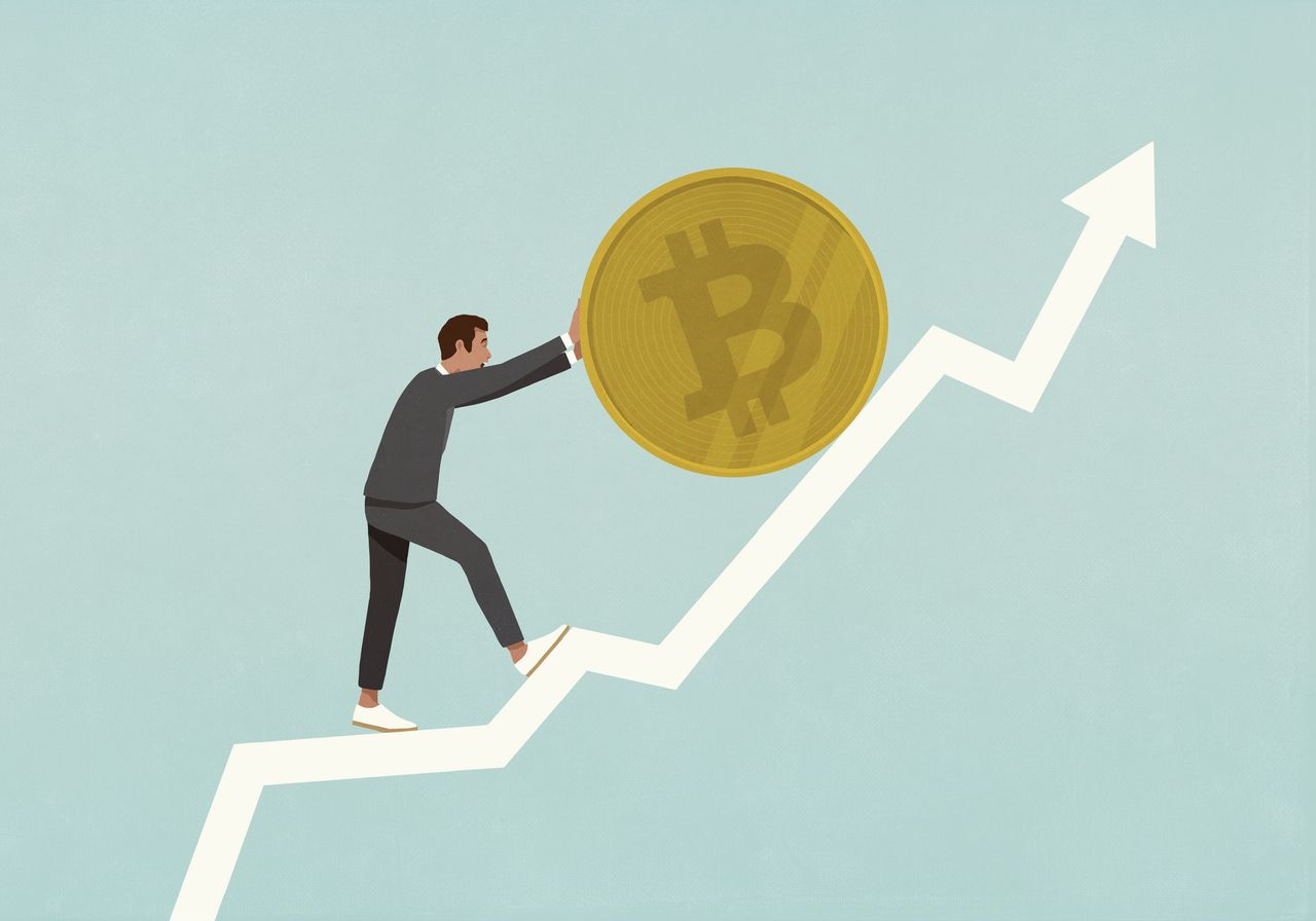 Businessman rolling Bitcoin up ascending data arrow