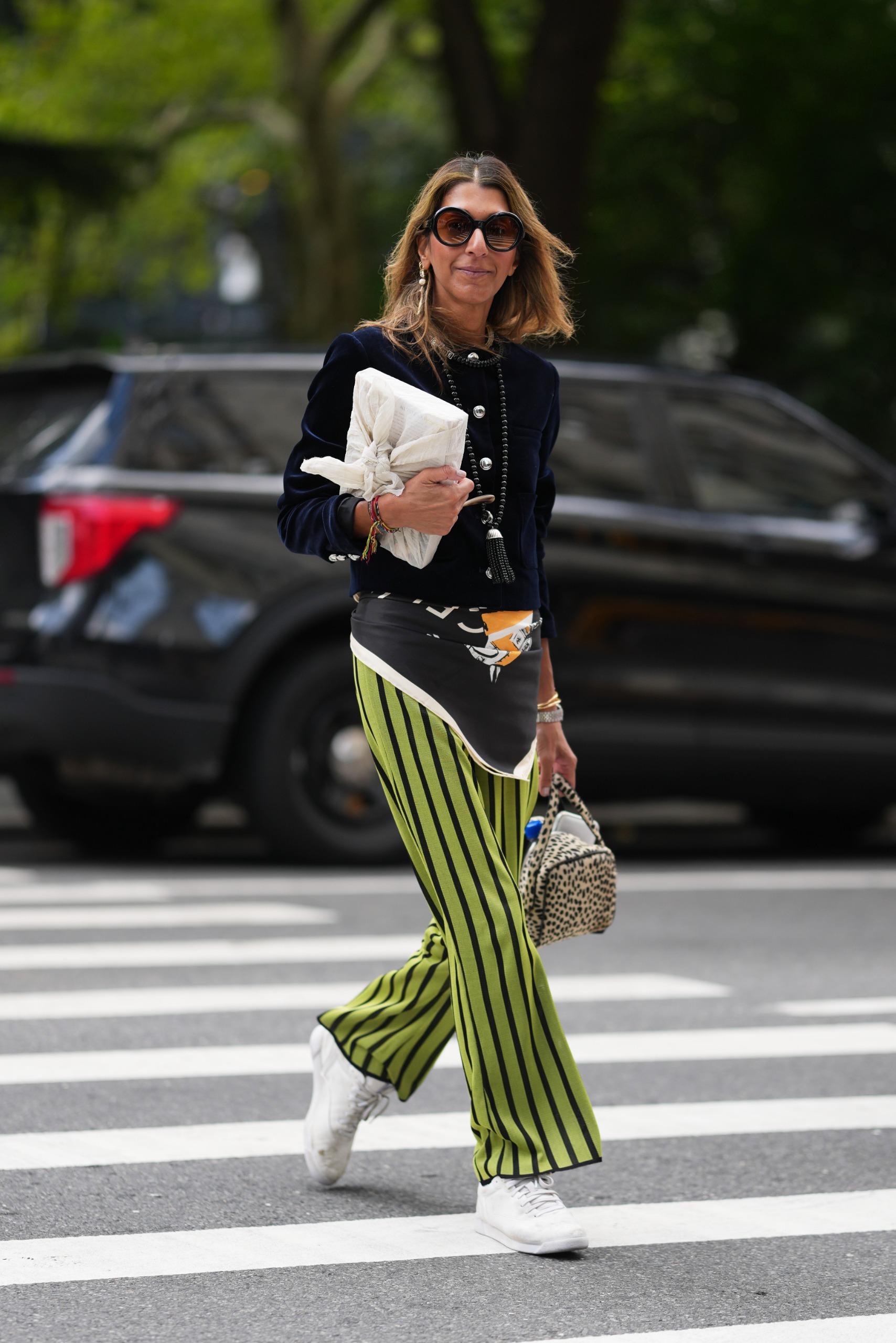 woman wearing a scarf over striped pants