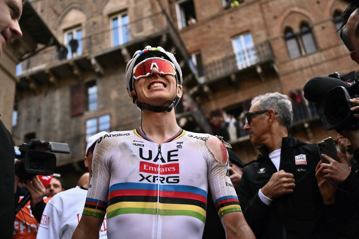 A visibly wounded Tadej Pogačar at the finish of Strade Bianche in Siena