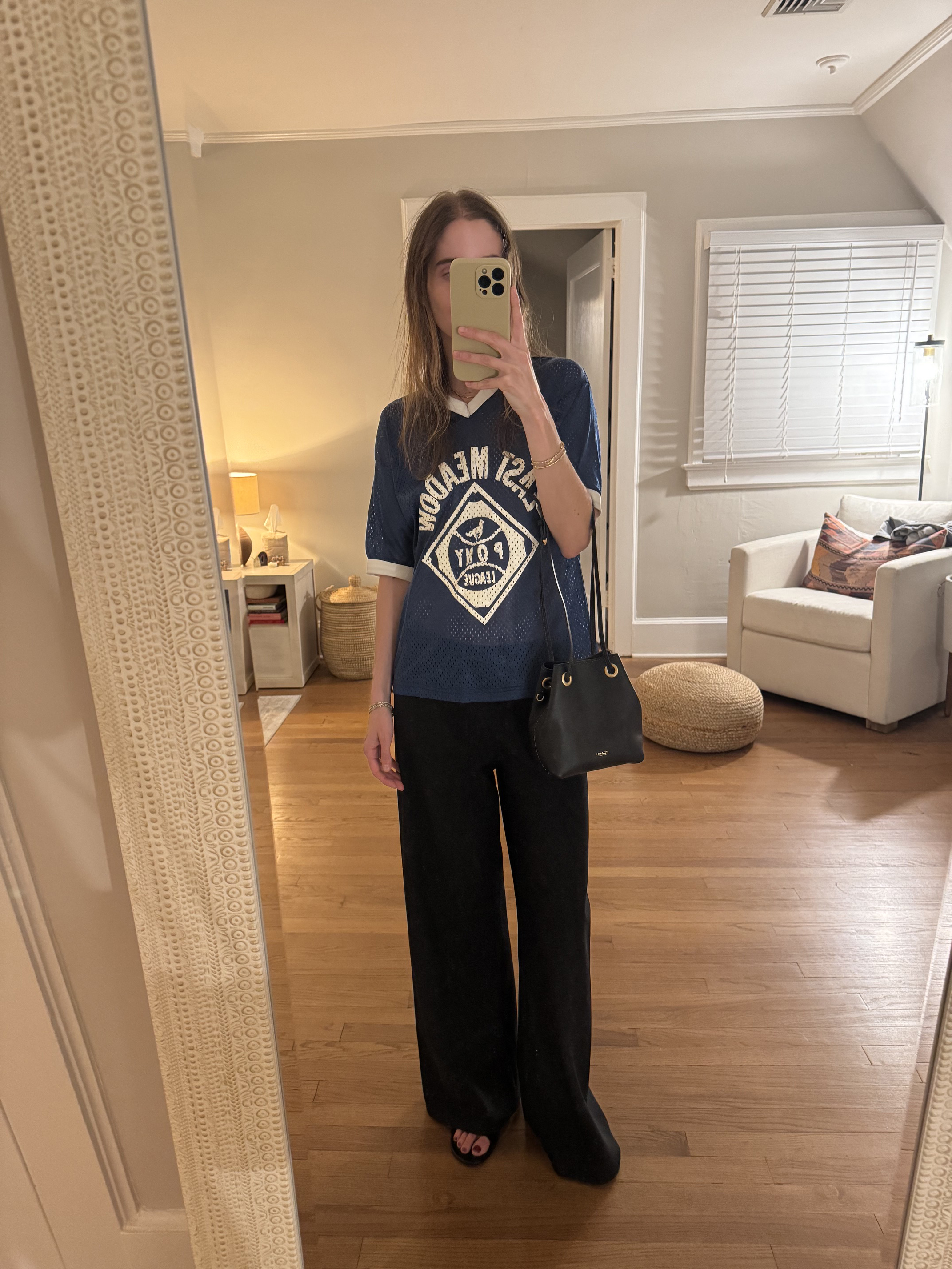 Tessa Faye O'Connell styling a Coach bag