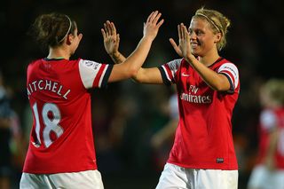 Emma Mitchell, celebrates with team mate Gilly Flaherty at the final whistle after winning the FA WSL Continental Cup Final between Arsenal Ladies and Lincoln Ladies at The Hive on October 4, 2013 in Barnet, England.