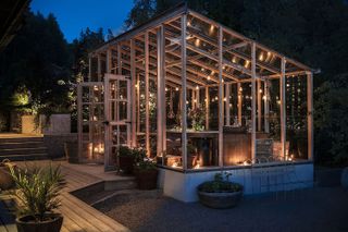 rustic garden ideas: greenhouse filled with festoon lights