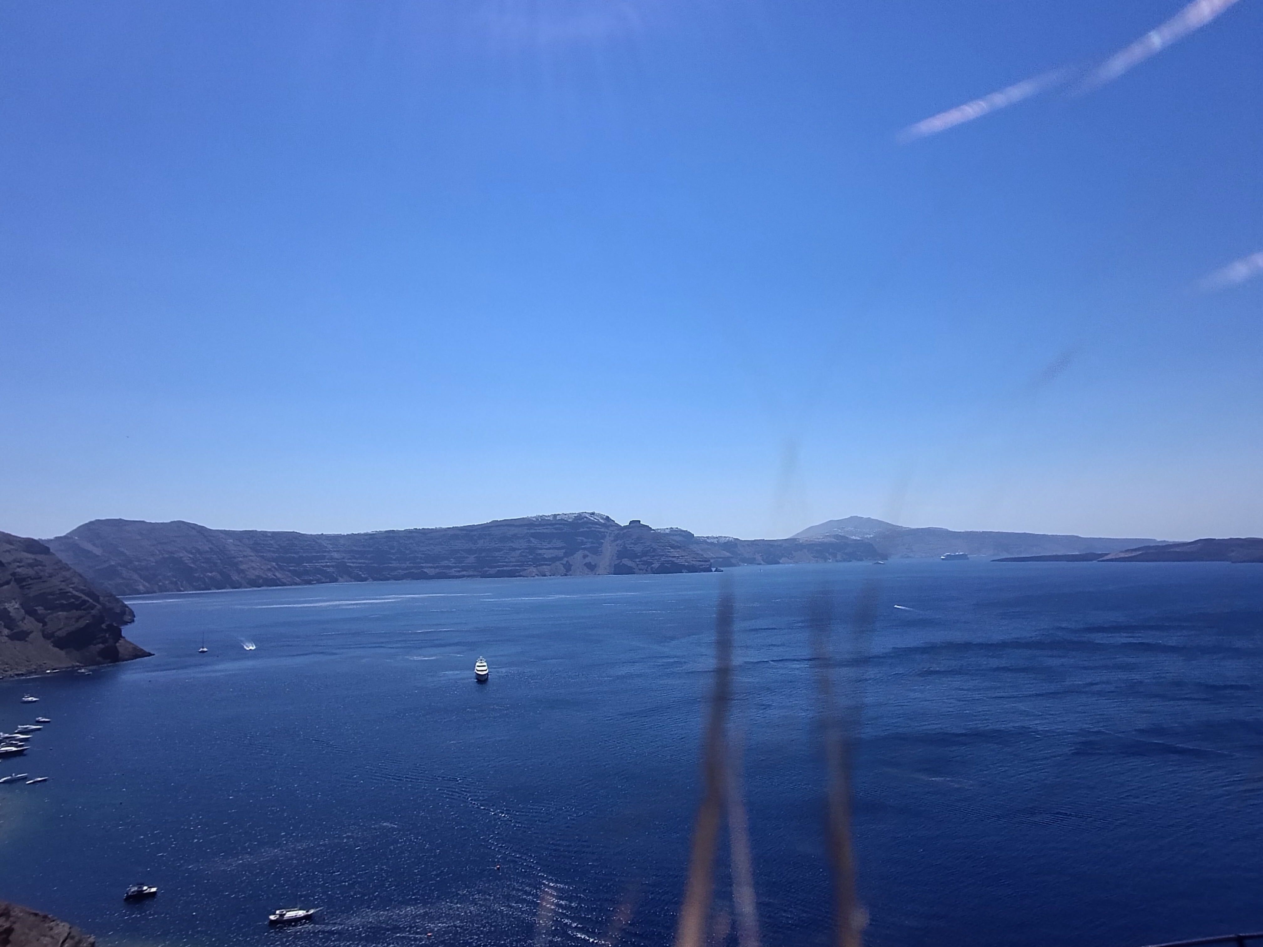 Test shots taken on the L'Atitude 52 smart glasses showing the sea featuring my hair caught in the breeze