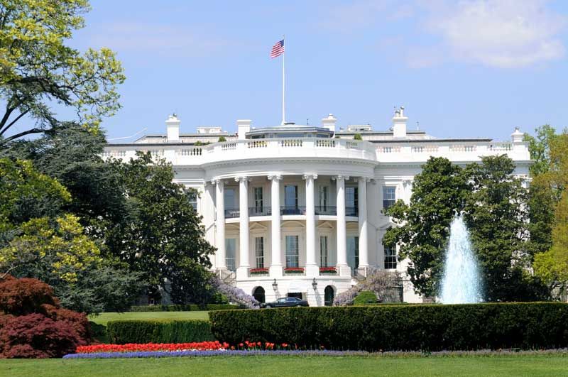 The south facade and south lawn of the White House in Washington, D.C., in spring colors .