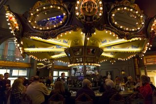 People sit at the Carousel Bar in New Orleans, Louisiana