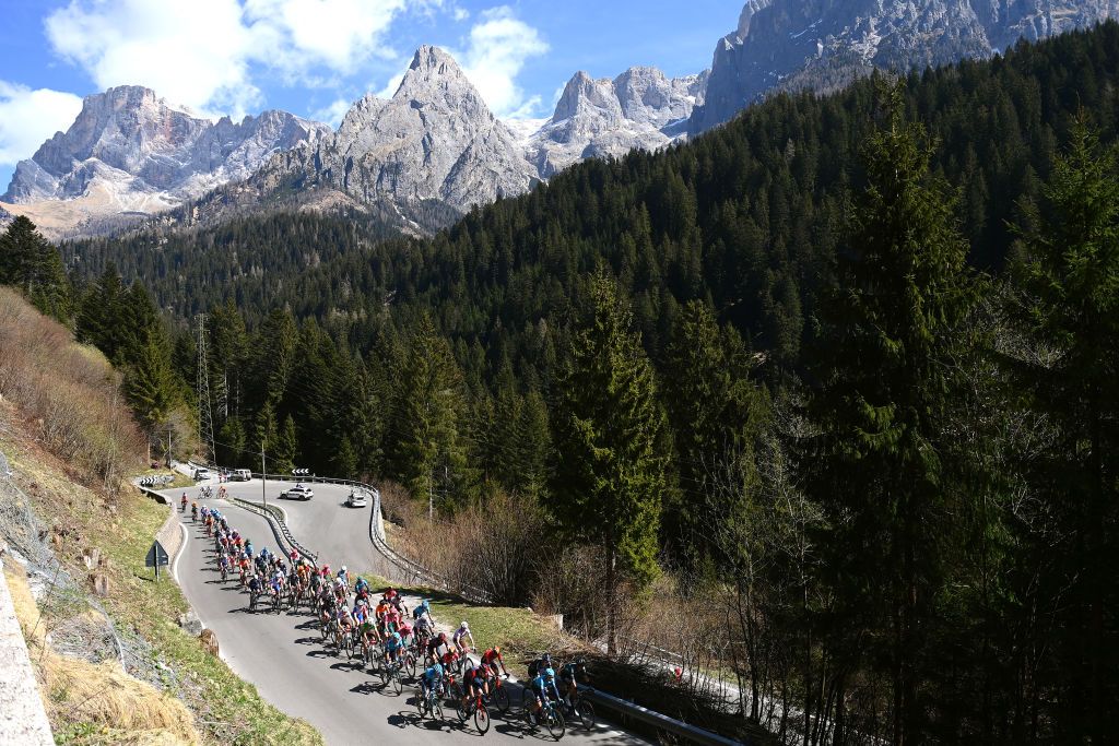 BOLZANO LANA ITALY APRIL 19 A general view of the Peloton passing through Passo Rolle 1973m during the 45th Tour of the Alps 2022 Stage 2 a 1541km stage from PrimieroS Martino di Castrozza to Lana TouroftheAlps on April 19 2022 in Bolzano Lana Italy Photo by Tim de WaeleGetty Images