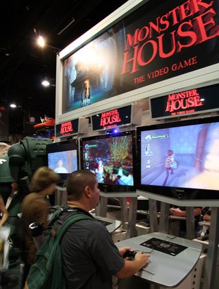 Attendees playing Monster House at the THQ booth