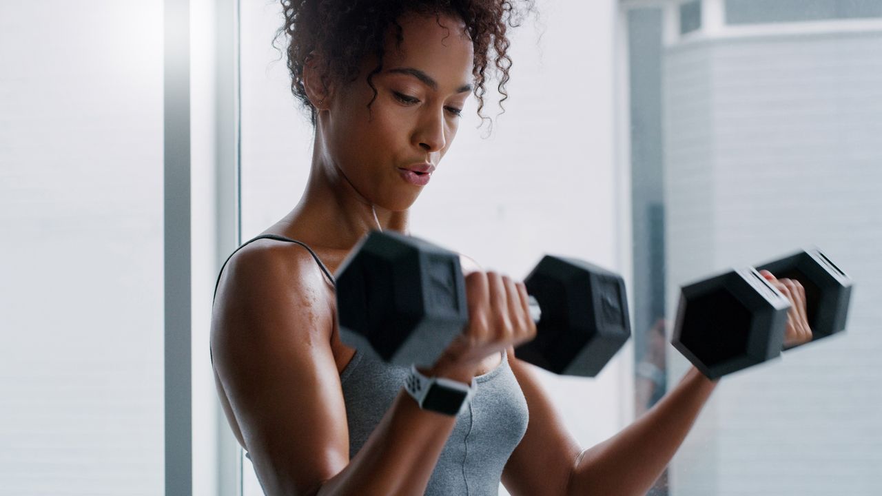 Woman lifting dumbbells