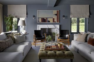 pale grey sofa with pillows in blue living room
