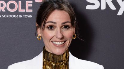 headshot of suranne jones wearing gold and white 