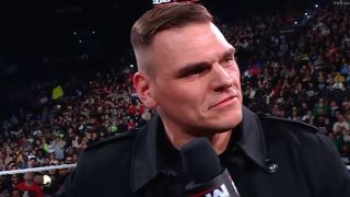 Gunther talks on the microphone during an episode of Raw.