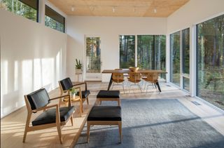 The main living room, with its high ceilings and woodland views