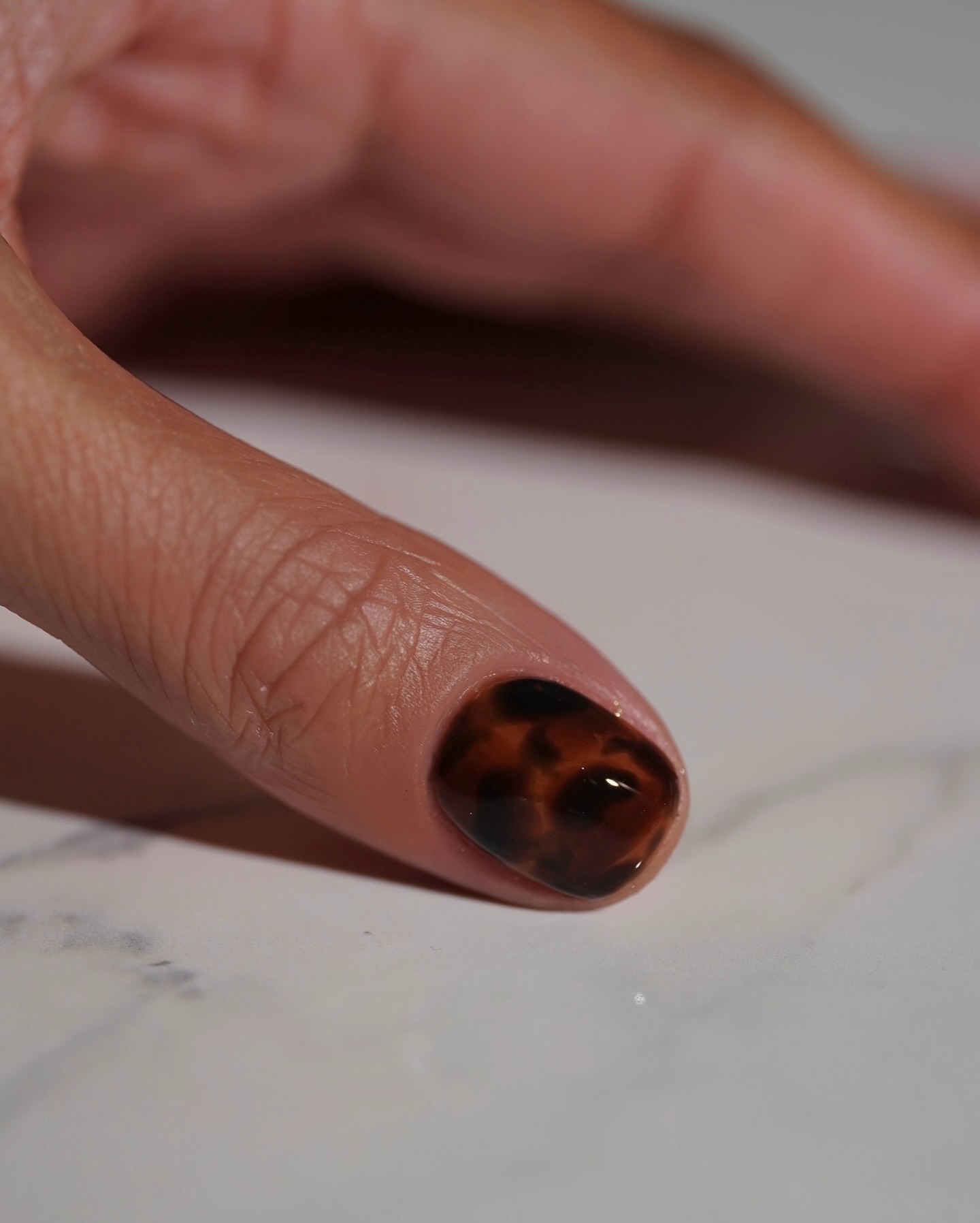 A close-up picture of tortoiseshell nail art