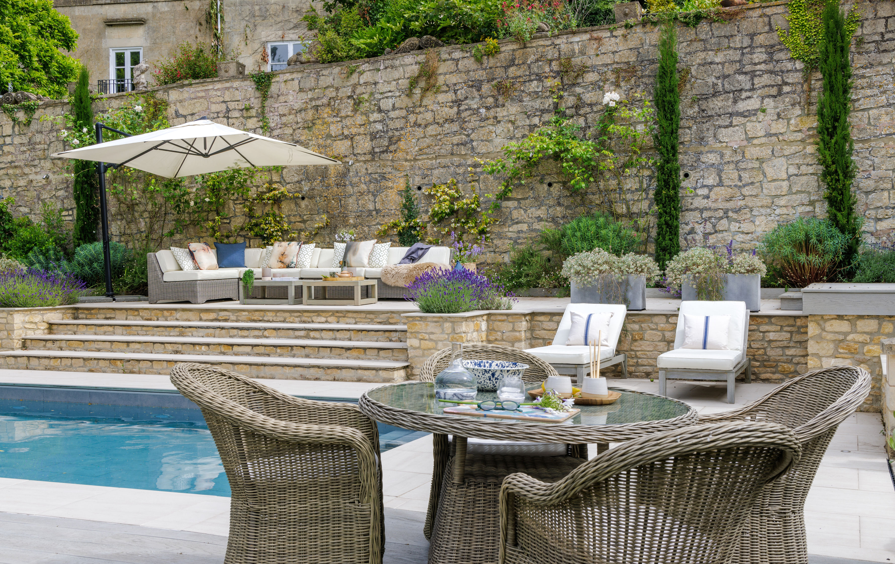 wicker seating area near a pool