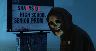 A figure wearing a skeleton mask stands in front of a sign that reads "Shadyside: High School Senior Prom". The letters DIE in Shadyside are highlighted in red. 