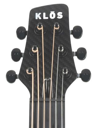 The headstock of a Klos Grand Cutaway Mini guitar