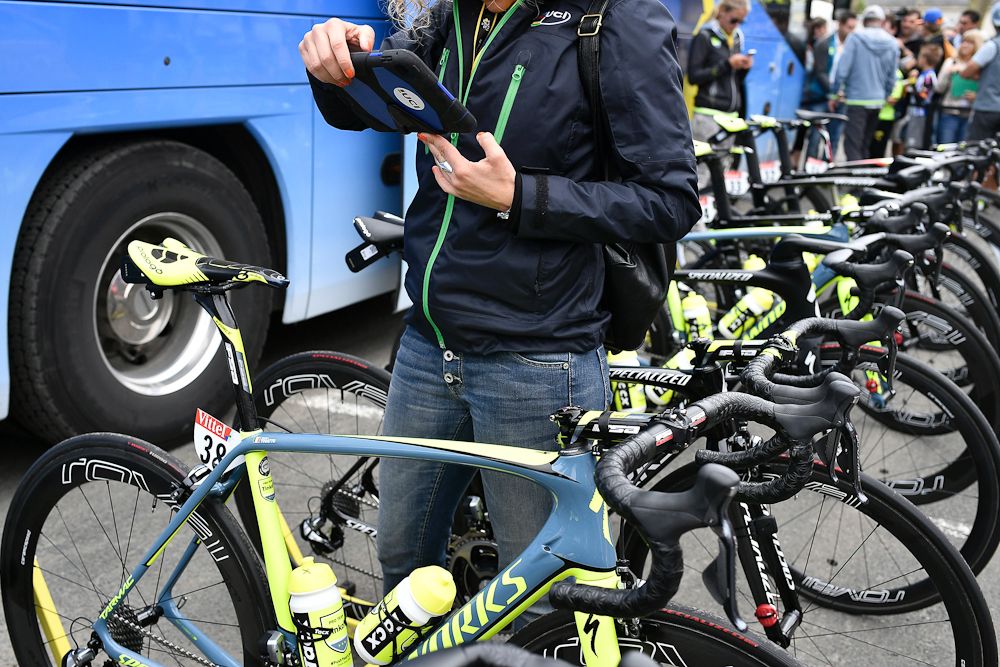 A UCI inspector examines bikes to detect hidden motors ahead of stage 4 at the 2016 Tour de France