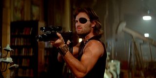 Kurt Russell Snake Plissken Escape From New York holding gun