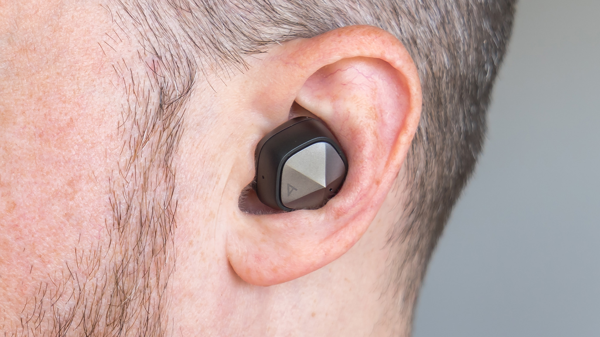 Close-up view of the Astell & Kern UW100 in the ear.