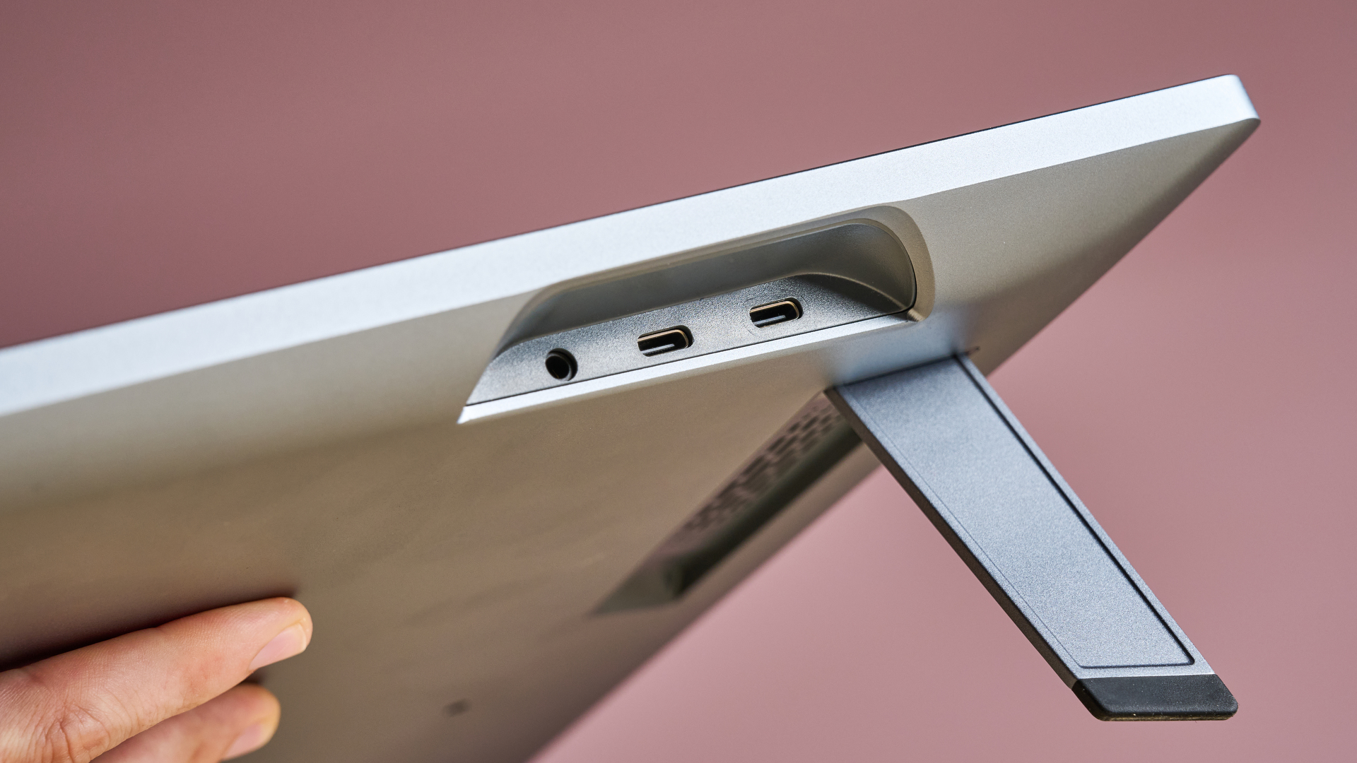 The side of the Huion Kamvas Pro 19, showing off its ports and stand.