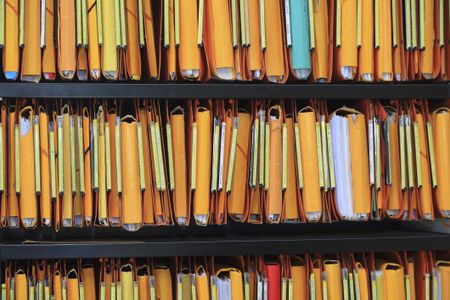 Shelves filled with paper files.