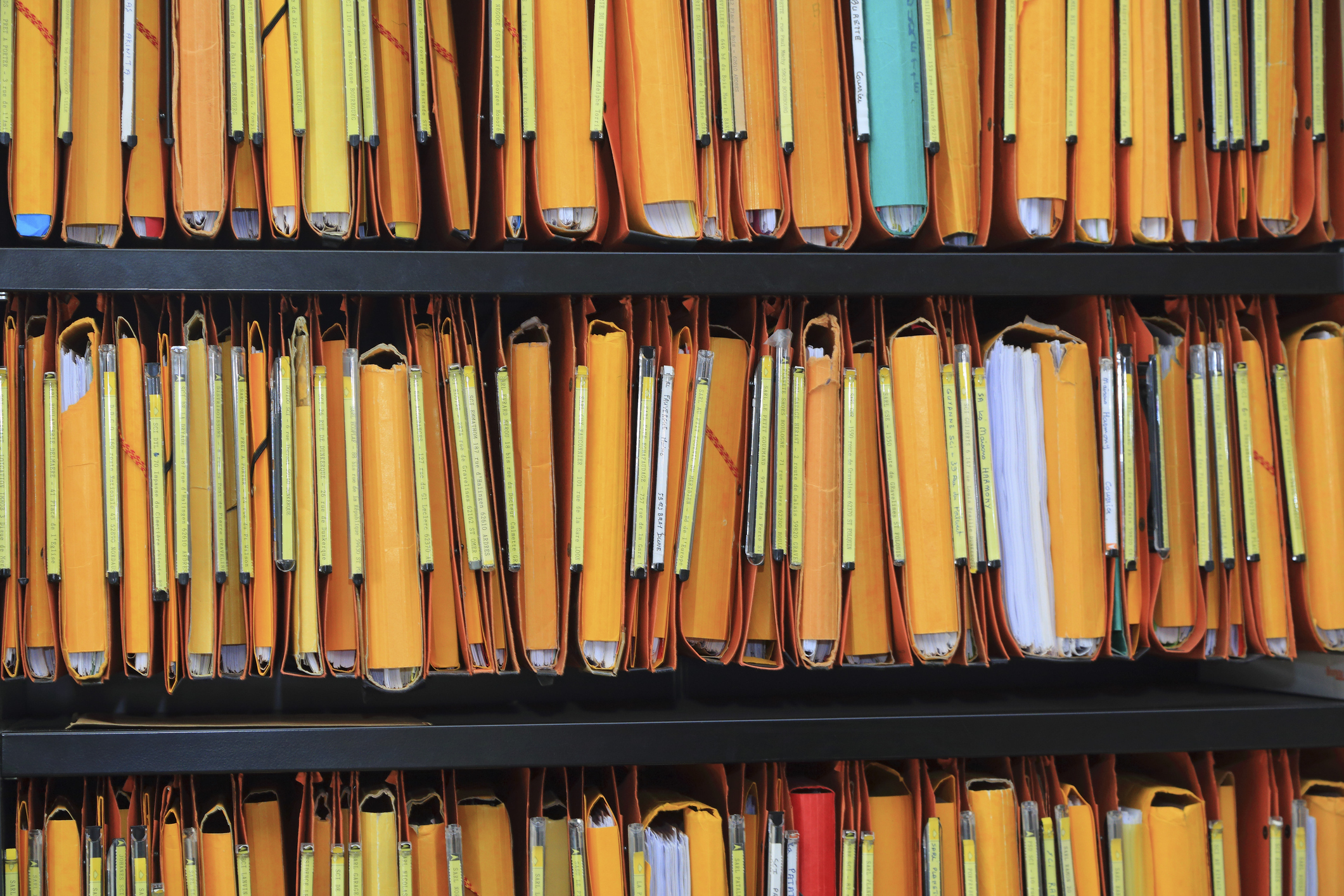 Shelves filled with paper files.