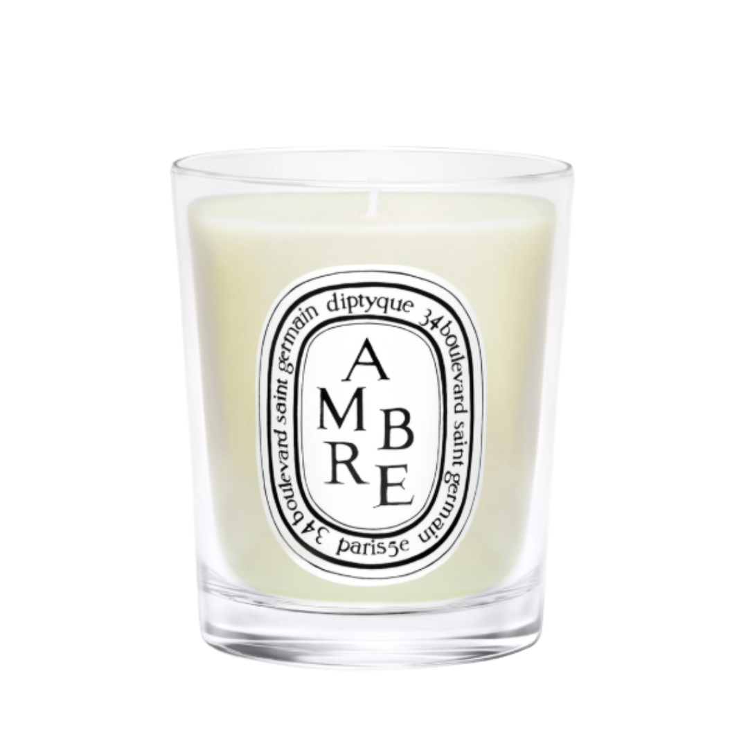 A product shot of the Diptyque Ambre candle, on a white background