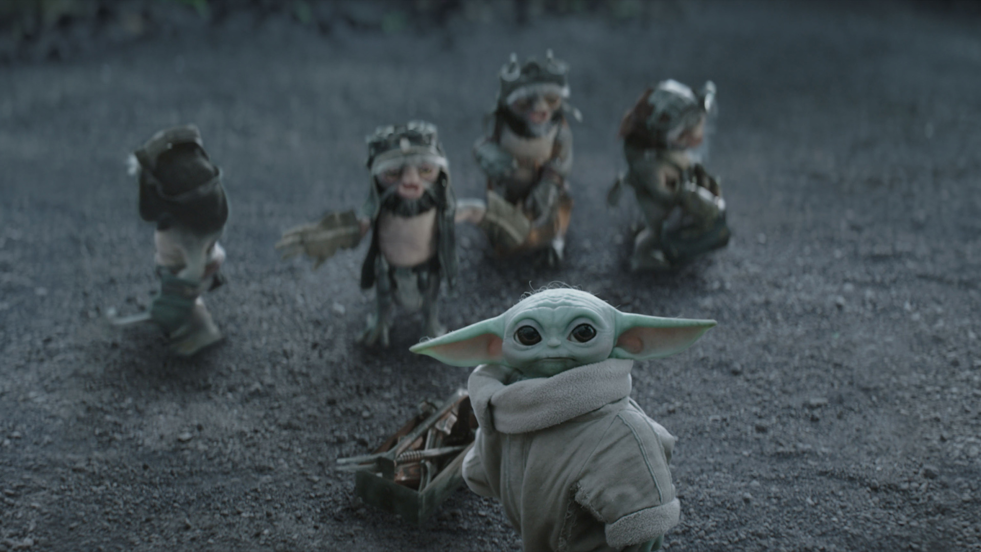 Baby Yoda and the Anzellans watch something in The Mandalorian and Grogu