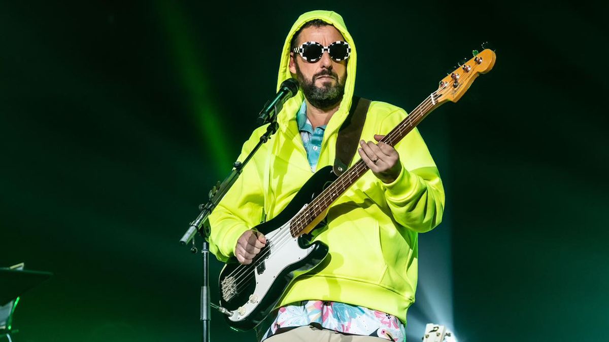 Adam Sandler playing guitar