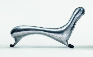 Australian-born designer's 'Lockheed Lounge' (1988) made from riveted aluminium, fibreglass, rubberised paint.