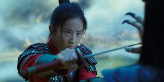 Mulan defends herself with a sword
