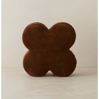 brown velvet pillow in the shape of a four leafed clover