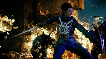 A screenshot a character fighting off foes while surrounded by flames in Dragon Age Inquisition.