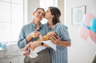 Female gay couple with newborn baby