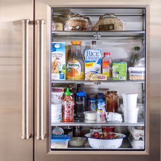 smart refrigerator with brown bread and glass shelf