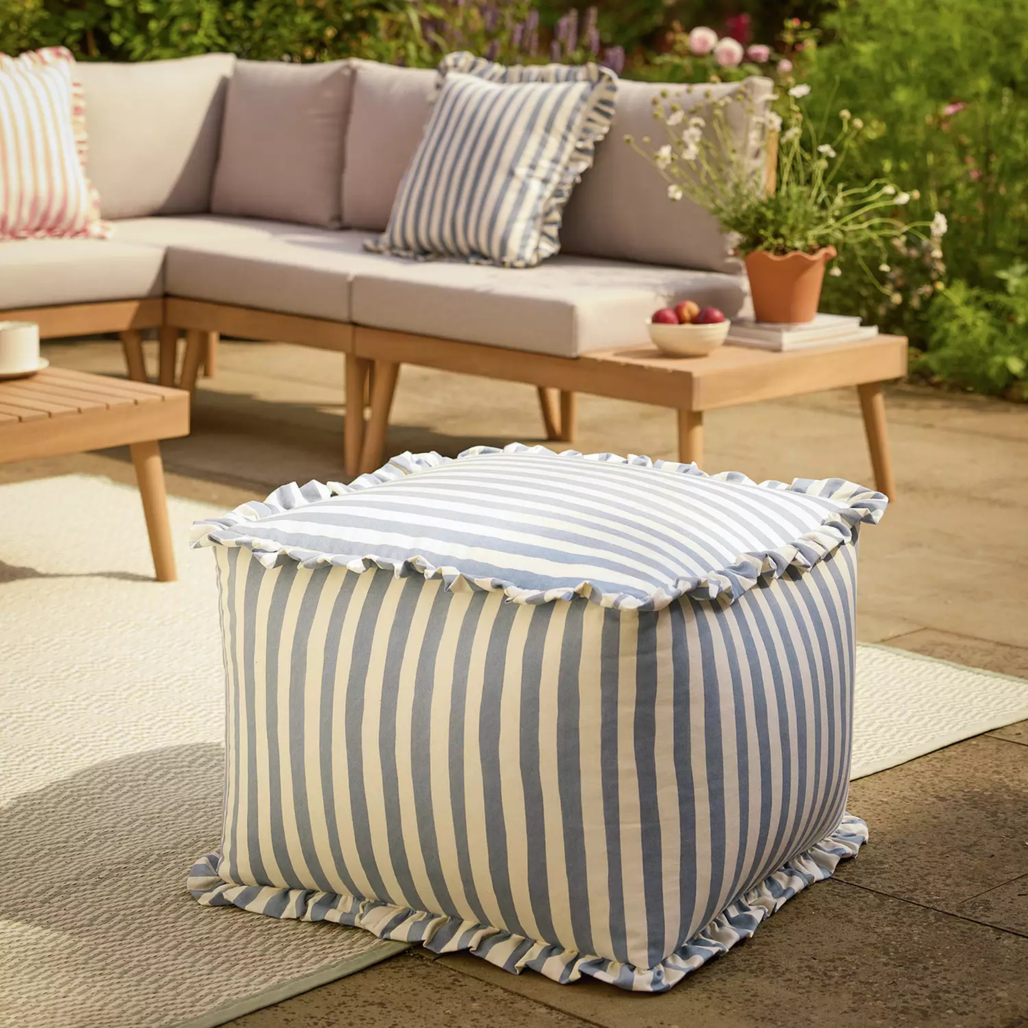 Habitat blue and white stripe ruffle outdoor pouffe.