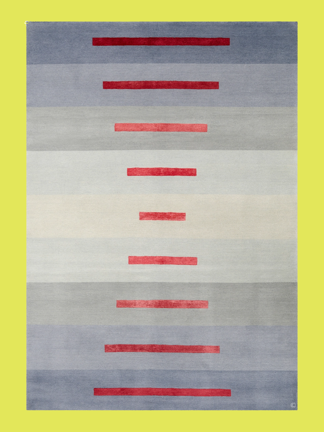 An ombre blue-gray rug with red strips from Deirdre Dyson