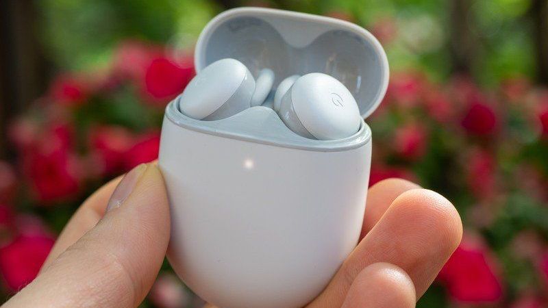 Google Pixel Buds A-Series in-hand with lid open outside