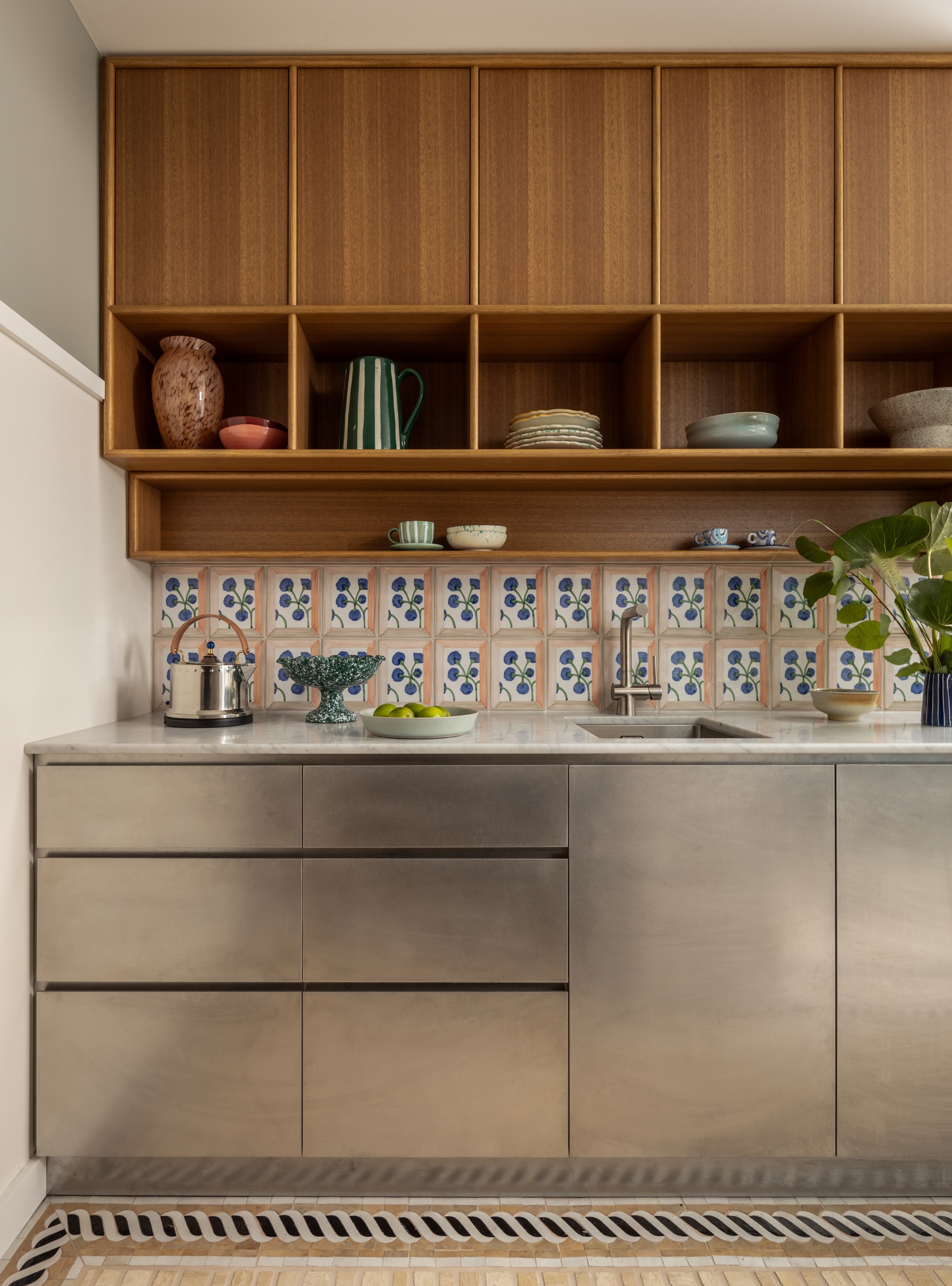 Kitchen with stainless steel cabinet door fronts
