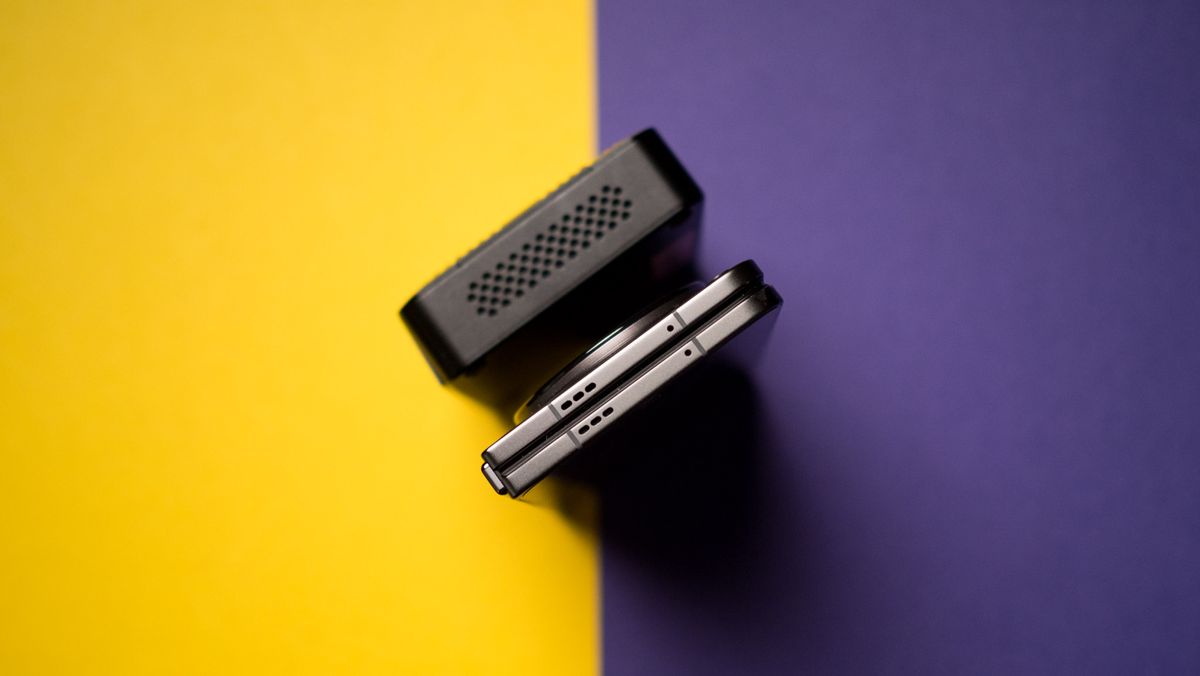Side view of Zotac Zbox Pico PI430AJ against OnePlus Open