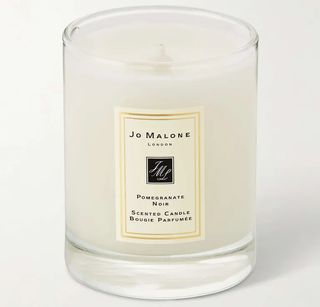 Jo Malone's white candle sits against a white background.