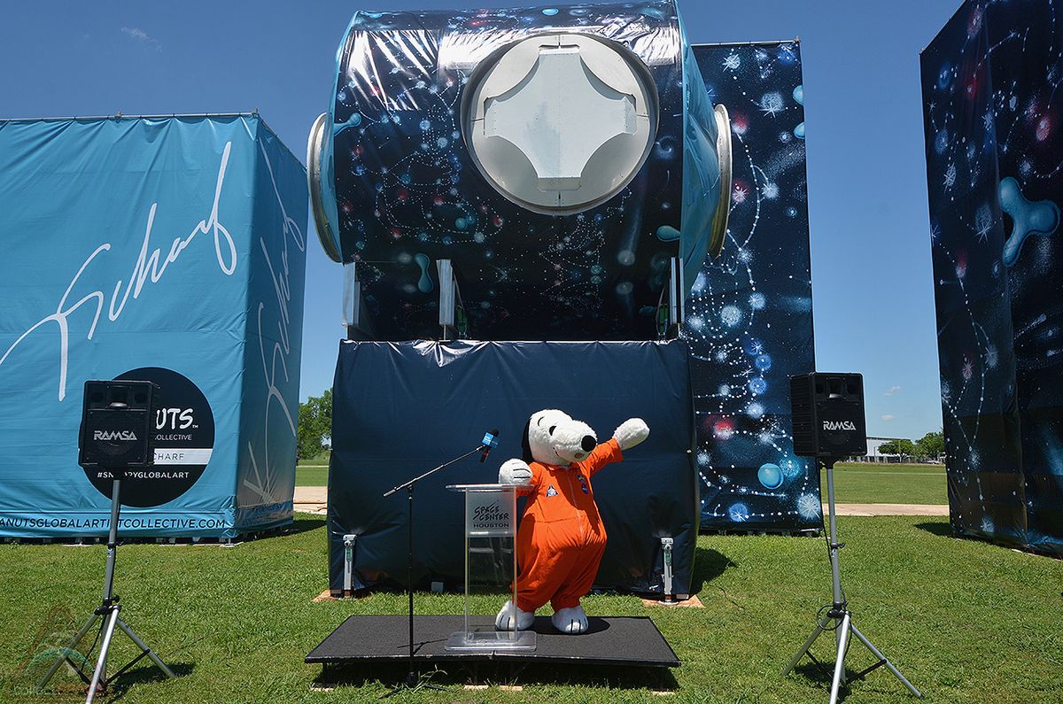 Snoopy, wearing a custom NASA spacesuit, poses before Kenny Scharf&#039;s art installation outside Space Center Houston in Texas on Thursday, April 25, 2019. The installation features Scharf&#039;s space-themed Peanuts mural wrapped around a retired training mockup of an International Space Station module