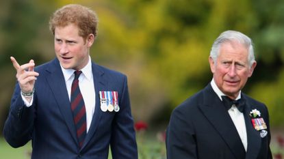 Prince Harry wears a suit featuring his military medals while his father King Charles wears a tuxedo